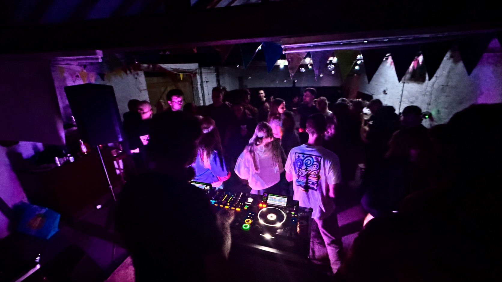 Crowd at a private party with purple lighting